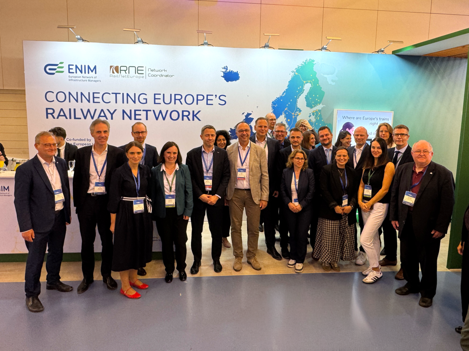 Group picture of ENIM and RailNetEurope representative at booth during the Connecting Europe Days 2026 in Bussels, Belgium