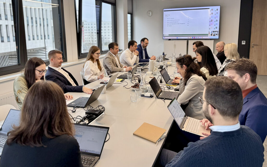 people sitting around a table in a meeting
