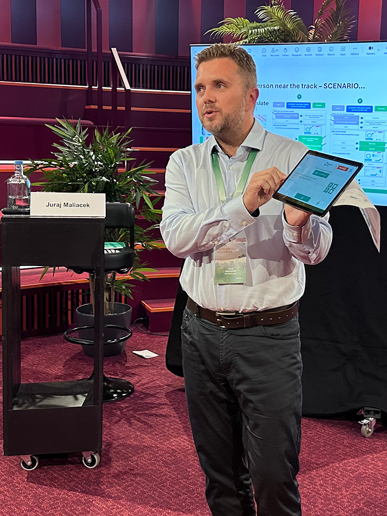 Juraj Maliacek speaking at the RNE Summer Academy 25 about the Traffic Management Language Tool